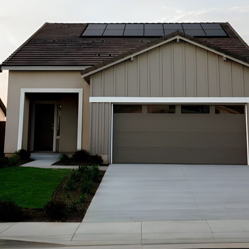 Modern home with a sectional garage door featuring horizontal panels and a row of small windows at the top.